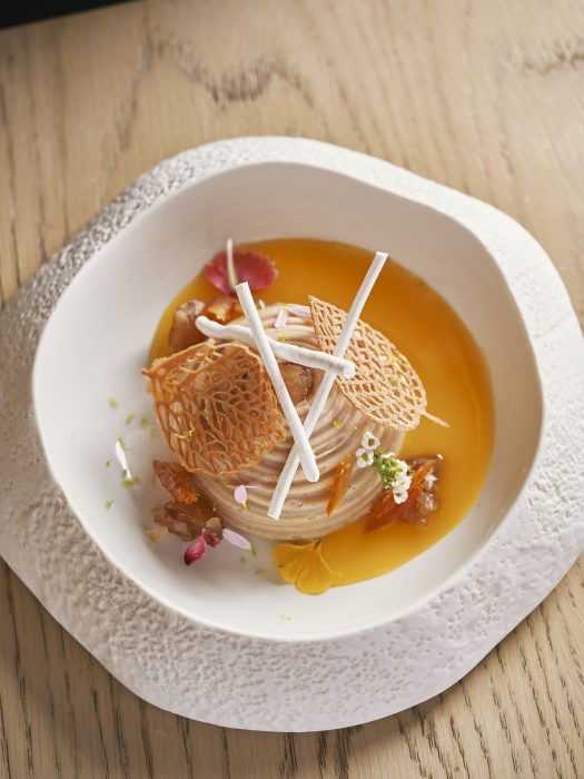 Our winter menu continues the alpine journey with exclusive dishes designed to warm and delight. Begin with Artichoke Romana, served with chestnut purée and salmoriglio, before moving to delicate Agnolotti del Plin, hand-pinched pasta pillows filled with veal and alpine herbs, finished in rich veal jus. Enjoy the hearty Braised Ossobuco with Polenta Taragna, slow-cooked veal ossobuco enriched with red wine jus and subtle juniper notes, paired with creamy polenta. Conclude with Monte Bianco, a classic dessert of sweetened chestnut purée with vanilla atop soft sponge, studded with candied fruits.
