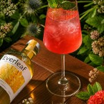 Alcohol-free botanical cocktail garnished with fresh mint at Azzurra Chelsea, featuring premium Everleaf aperitif in a vibrant garden-inspired setting.