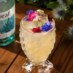Elegant alcohol-free botanical mocktail garnished with edible flowers and served at Azzurra Chelsea, Chelsea’s destination for premium Italian dining and cocktails.