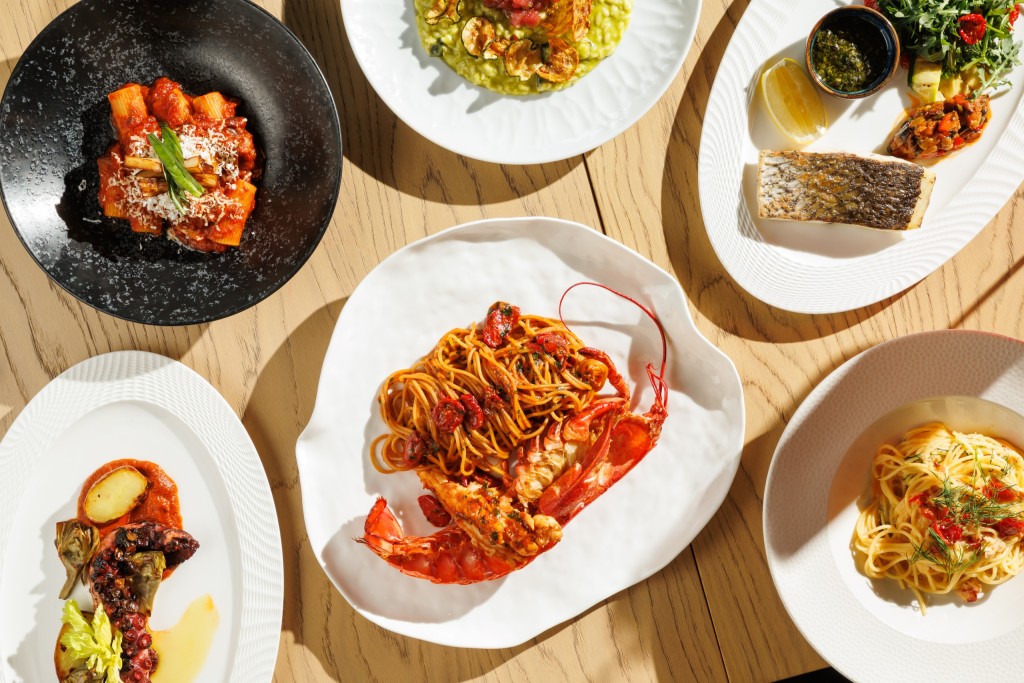 Italian seafood and pasta dishes at Azzurra Chelsea featuring lobster spaghetti, rigatoni, grilled octopus, seabass and Mediterranean cuisine served on a sunlit dining table in London.
