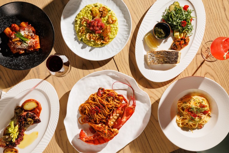 A selection of signature dishes at Azzurra Chelsea including lobster spaghetti, seafood pasta, grilled fish, risotto and traditional Italian cuisine in Chelsea, London.