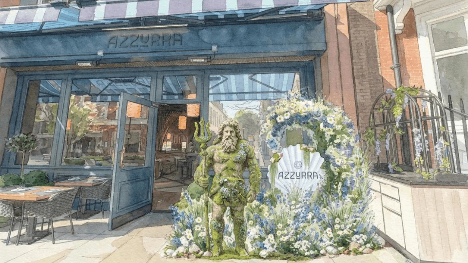 Azzurra Chelsea decorated for Chelsea in Bloom with a striking floral installation inspired by the sea, showcasing the restaurant’s iconic King’s Road entrance in London.