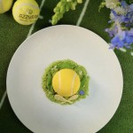 Wimbledon-inspired tennis ball dessert at Azzurra Chelsea, creatively plated with edible flowers and seasonal flavours for summer dining in London.