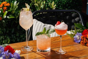 Three signature summer cocktails on the terrace at Azzurra Chelsea, an Italian seafood restaurant in Chelsea, London, featuring seasonal serves in a sunny outdoor setting.